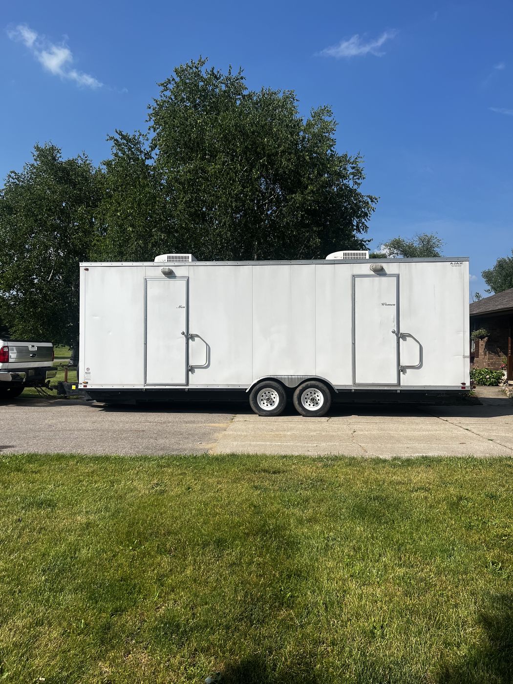Trailer exterior with Men and Women suites