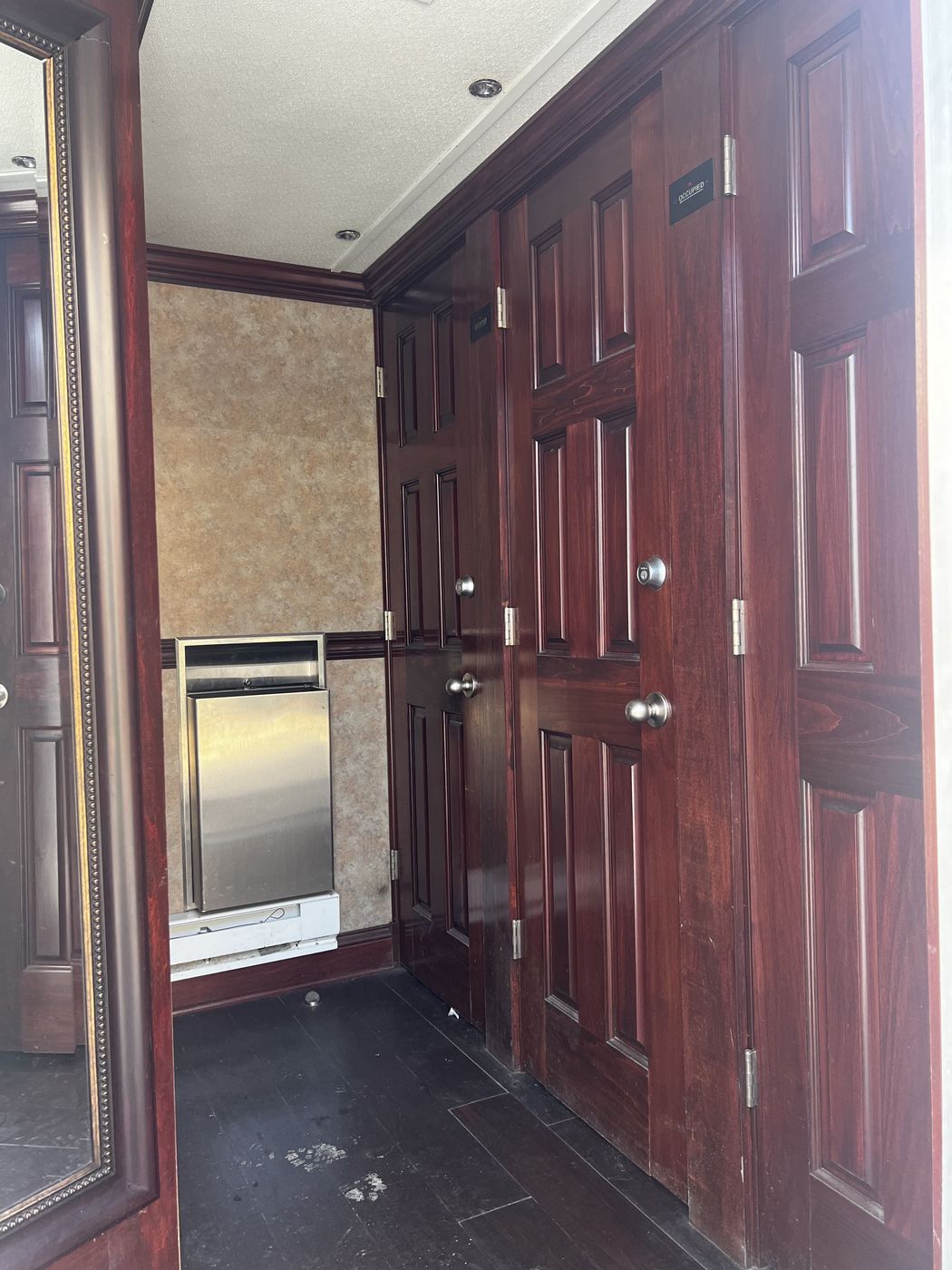 Interior hallway with stall doors