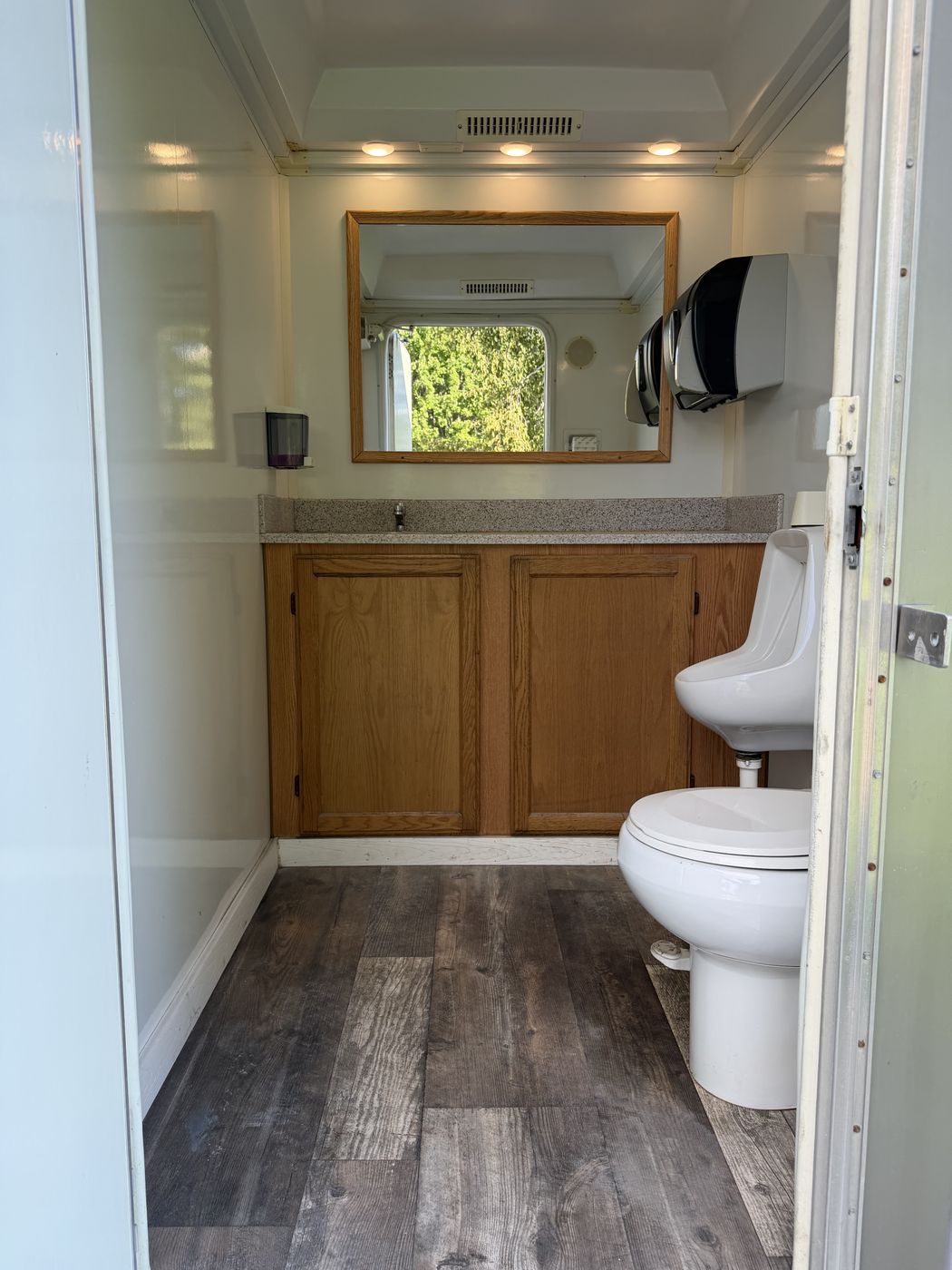 Men's suite interior with toilet and urinal